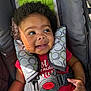 Icelynn joined the competition — help win amazing prizes! baby, child, car_seat, smiling, curly_hair, red_onesie, safety_harness, sunlight, shadow, infant, seat_belt, happy, portrait, closeup, cute, young, seat, indoors, person, toddler