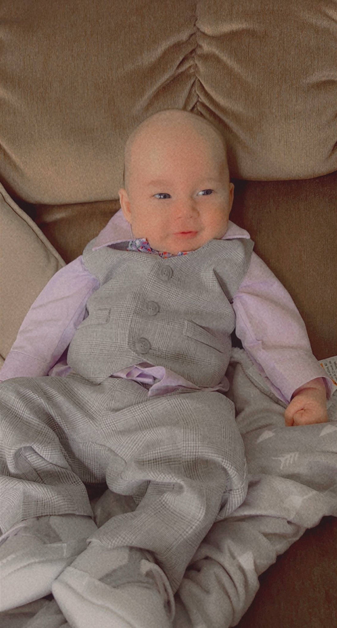 Aiden is registered to the contest to win money with this photo: baby, baby_products, baby_toddler_clothing, cheek, chin, comfort, eye, finger, human_body, iris, lap, linens, lip, nose, person, pink, product, skin, sleeve, smile