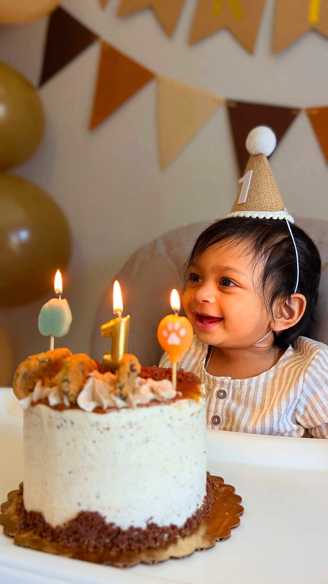 Rishi joined the competition — help win amazing prizes! baby, birthday, cake, candle, celebration, child, party_hat, smile, happy, highchair, indoor, food, cookies, decorations, balloons, bunting, cream, icing, first_birthday, person