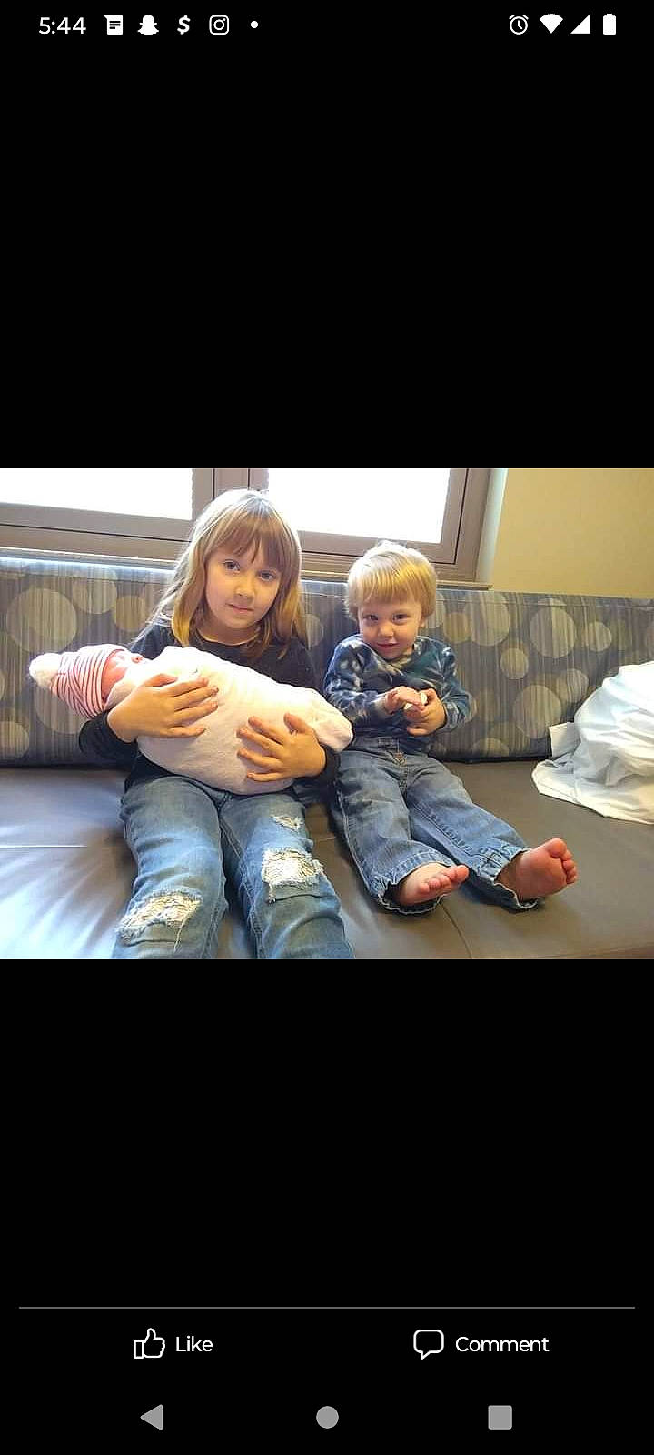 Kash joined the competition — help win amazing prizes! baby, boot, child, comfort, couch, display_device, electronic_device, event, finger, flash_photography, fun, gesture, happy, lap, person, room, sitting, sneakers, thumb, toddler