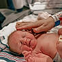 Lily is registered to the contest to win money with this photo: newborn, baby, hospital, hand, skin, blanket, striped, infant, touch, care, medical, patient, wristband, person, closeup, lying, soft, cute, newborn_baby, healthcare