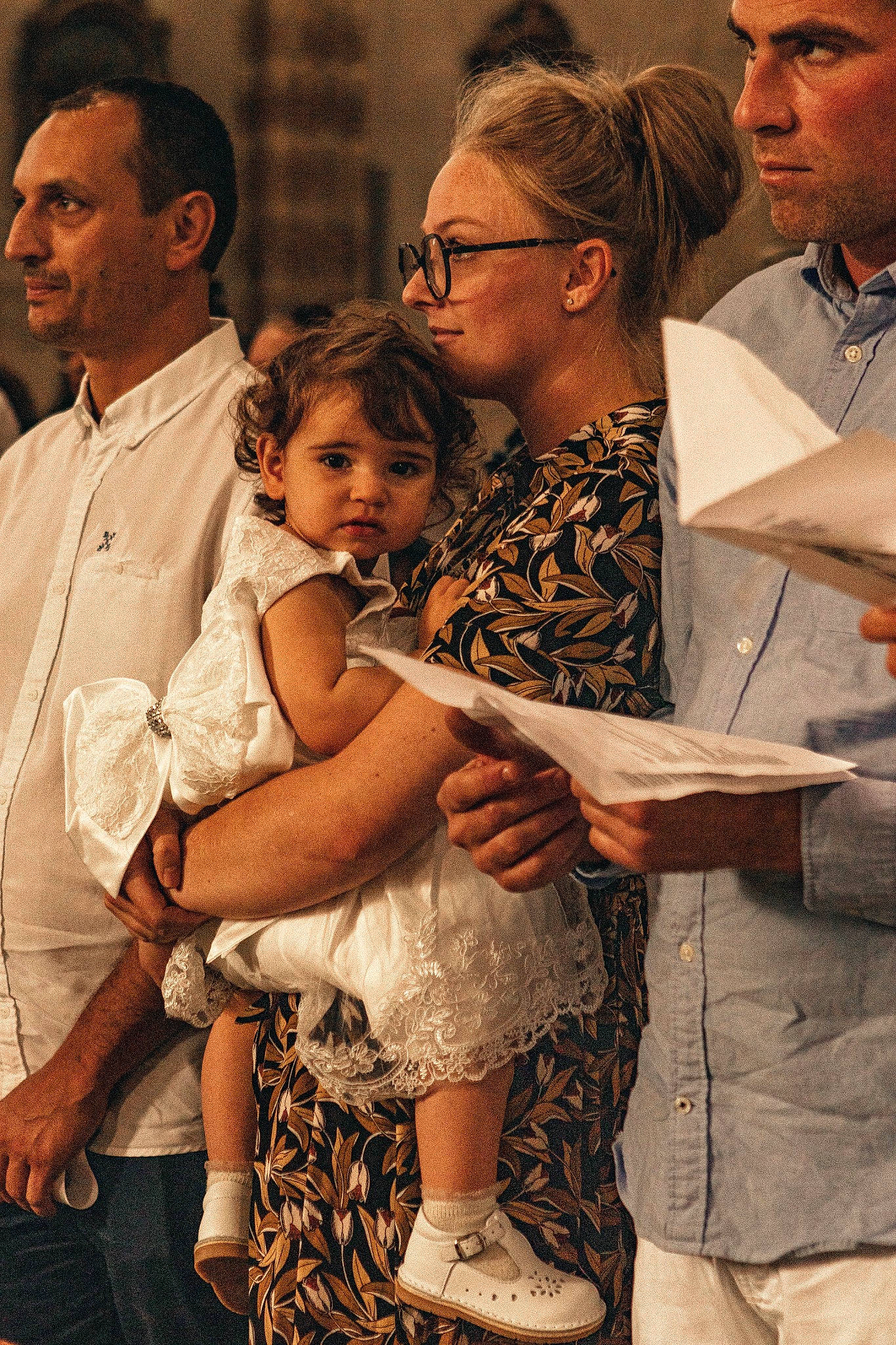 Capucine a rejoint le concours — aidez-le/la à gagner de superbes lots ! ceremony, child, event, eyewear, facial_expression, family, fashion_design, formal_wear, fun, hair, happy, headwear, interaction, jewellery, necklace, person, ritual, sandal, sitting, tie