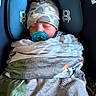 newborn, baby, pacifier, blanket, car_seat, hat, sleeping, child, infant, cozy, camo_pattern, blue, comfort, resting, soft, wrapped, cute, face, headwear, baby_accessory