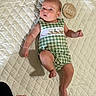 Sutton joined the competition — help win amazing prizes! baby, infant, child, romper, green_checkered, quilted_blanket, plaque, wooden_plaque, three_months, embroidery, duck, cute, lying_down, indoor, skin, hand, foot, face, expression, soft_light
