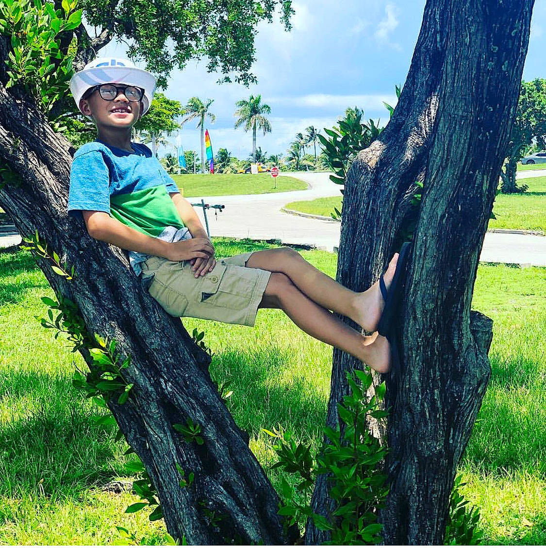 Kevin joined the competition — help win amazing prizes! beauty, botany, branch, cool, eyewear, grass, green, happy, headwear, joy, leisure, people_in_nature, person, photography, plant, sitting, spring, summer, sunglasses, tree