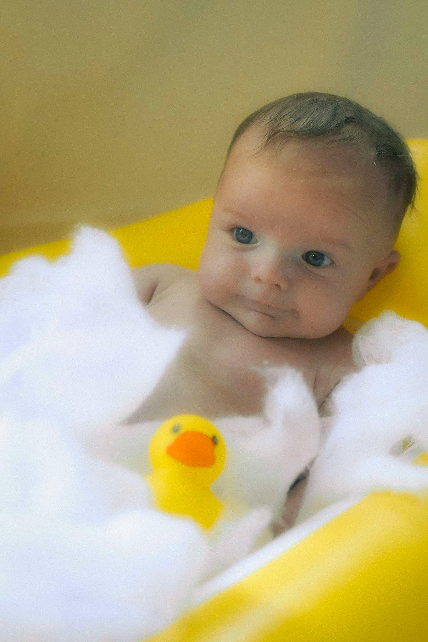 Bennett is registered to the contest to win money with this photo: _geese_and_swans, baby, baby_playing_with_toys, baby_products, baby_toys, bath_toy, bathing, bathtub, cheek, chest, child, ducks, flooring, fun, happy, person, play, room, rubber_ducky, smile