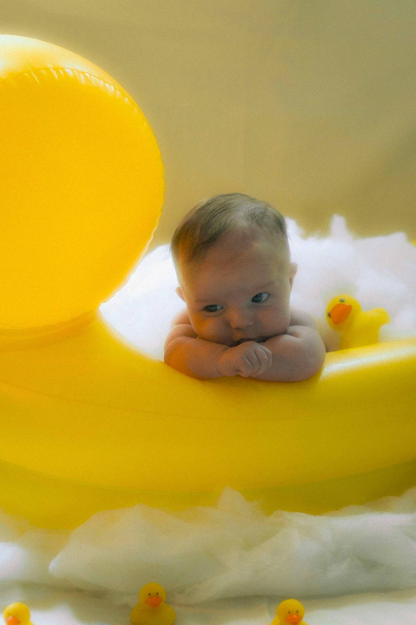 Bennett is registered to the contest to win money with this photo: baby, baby_playing_with_toys, baby_products, baby_toddler_clothing, baby_toys, bath_toy, cheek, child, comfort, finger, flooring, fun, hand, happy, orange, person, rubber_ducky, skin, stomach, toddler
