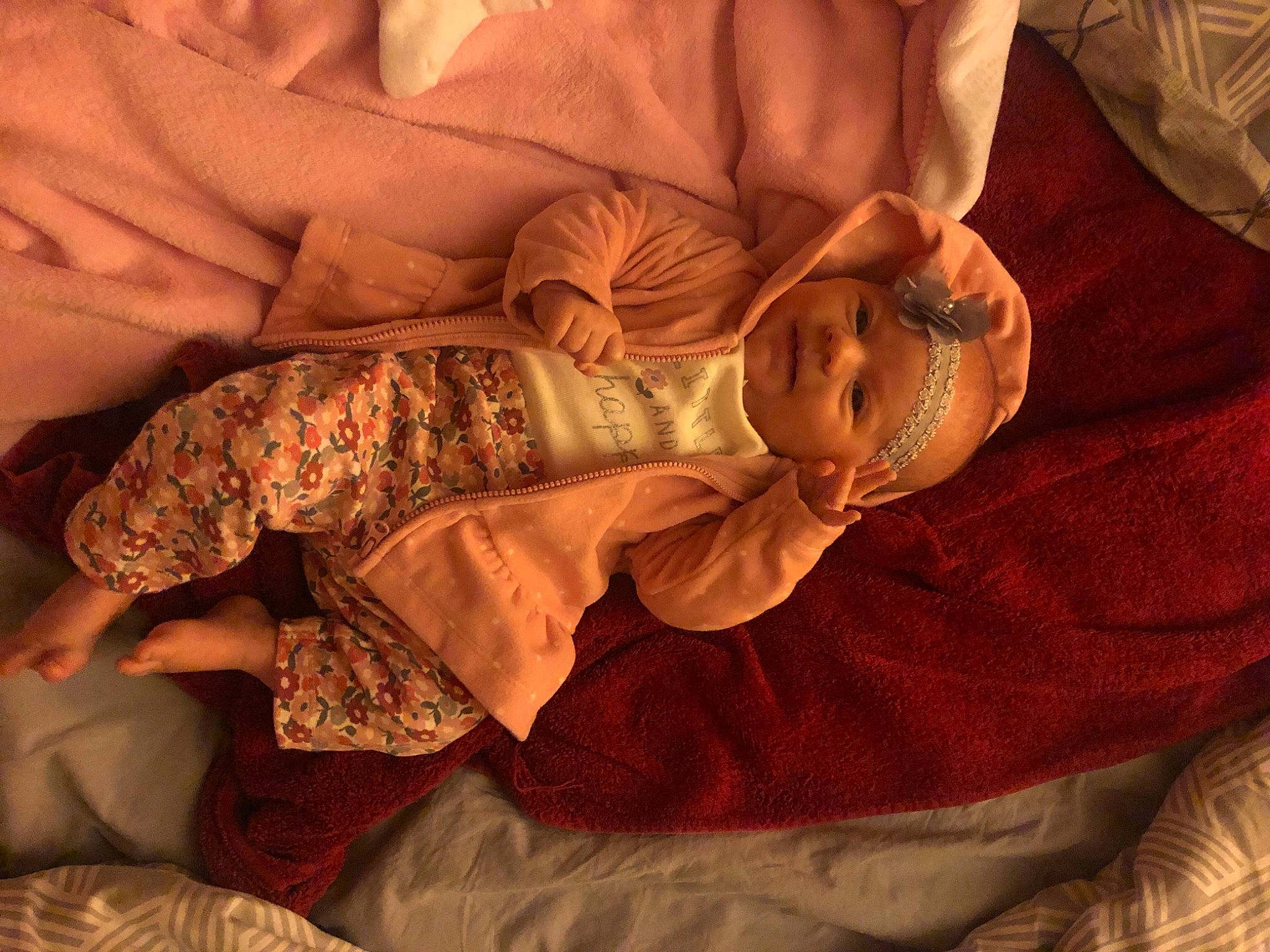 Bexlee joined the competition — help win amazing prizes! baby, bedtime, child, close_up, comfort, dress, event, eye, finger, glasses, headwear, human_body, human_leg, linens, mouth, orange, person, room, skin, toddler