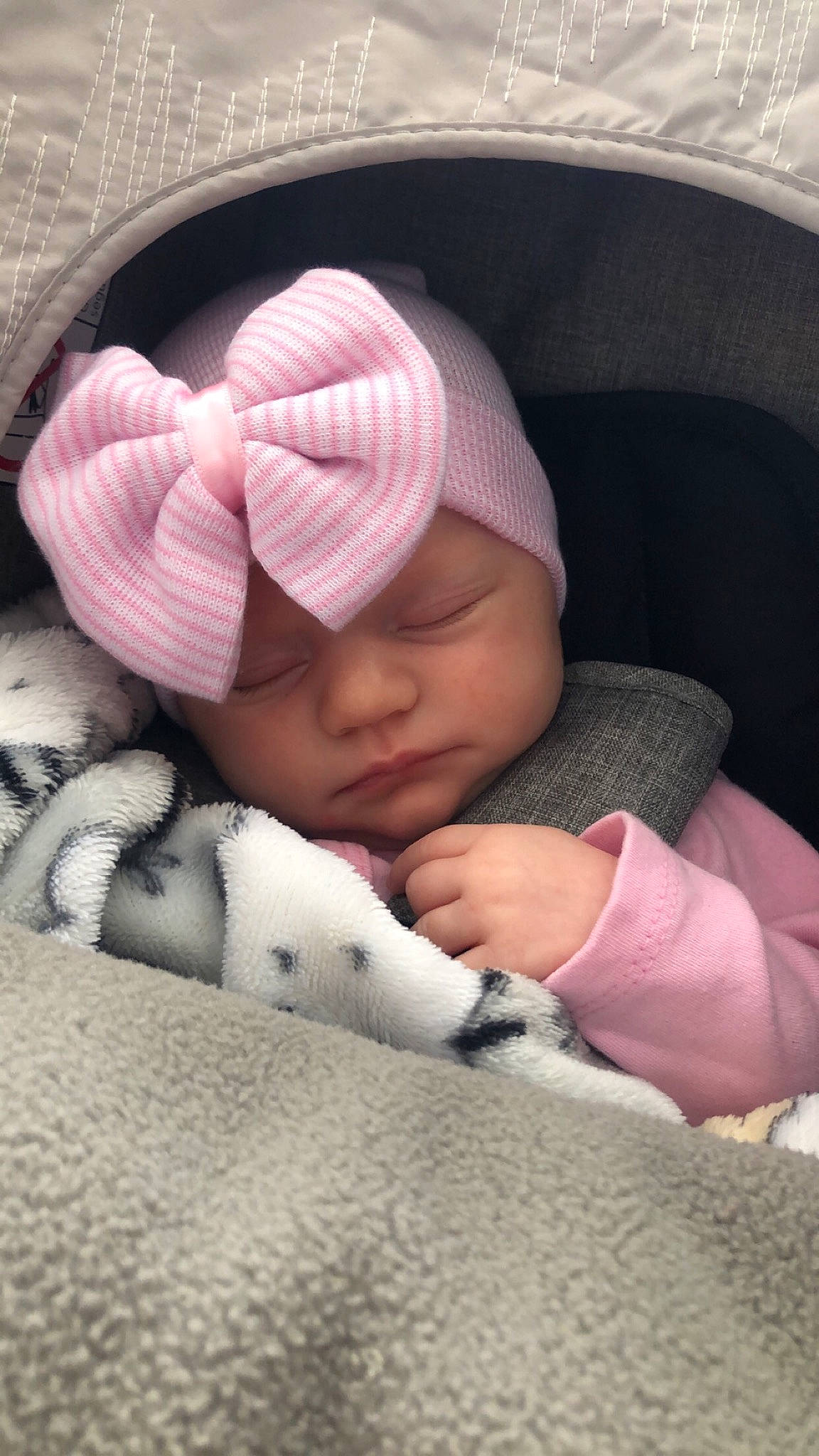 Bexlee joined the competition — help win amazing prizes! baby, baby_products, baby_sleeping, beanie, cap, cheek, child, comfort, finger, headwear, knit_cap, linens, mammal, nap, outerwear, person, petal, pink, skin, textile