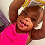 toddler, child, smiling, pink_clothing, tank_top, holding, yellow_bag, indoor, closeup, happy, cute, face, person, skin, arm, hair, earring, playful, expression, young