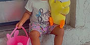 Chloe is registered to the contest to win money with this photo: toddler, child, smiling, sitting, doorstep, plush_toy, yellow, pink_bucket, bunny, bonnet, pajamas, crocs, happy, cute, outdoor, front_door, playful, person, clothing, footwear