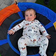 Jason joined the competition — help win amazing prizes! baby, blue_eyes, child, colorful, cute, fabric, foot, grass, happy, infant, onesie, outdoor, patterned_clothing, person, playtime, relaxing, rope, smile, swing, toy