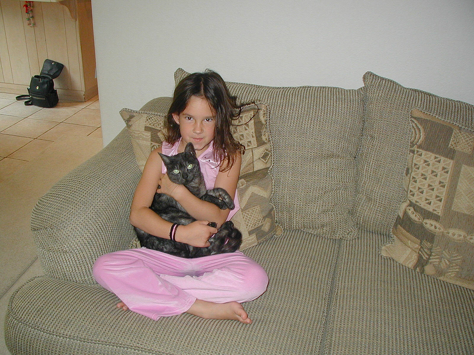 Moggin is registered to the contest to win money with this photo: finger, flooring, fun, furniture, girl, leg, person, sitting, thigh, trunk