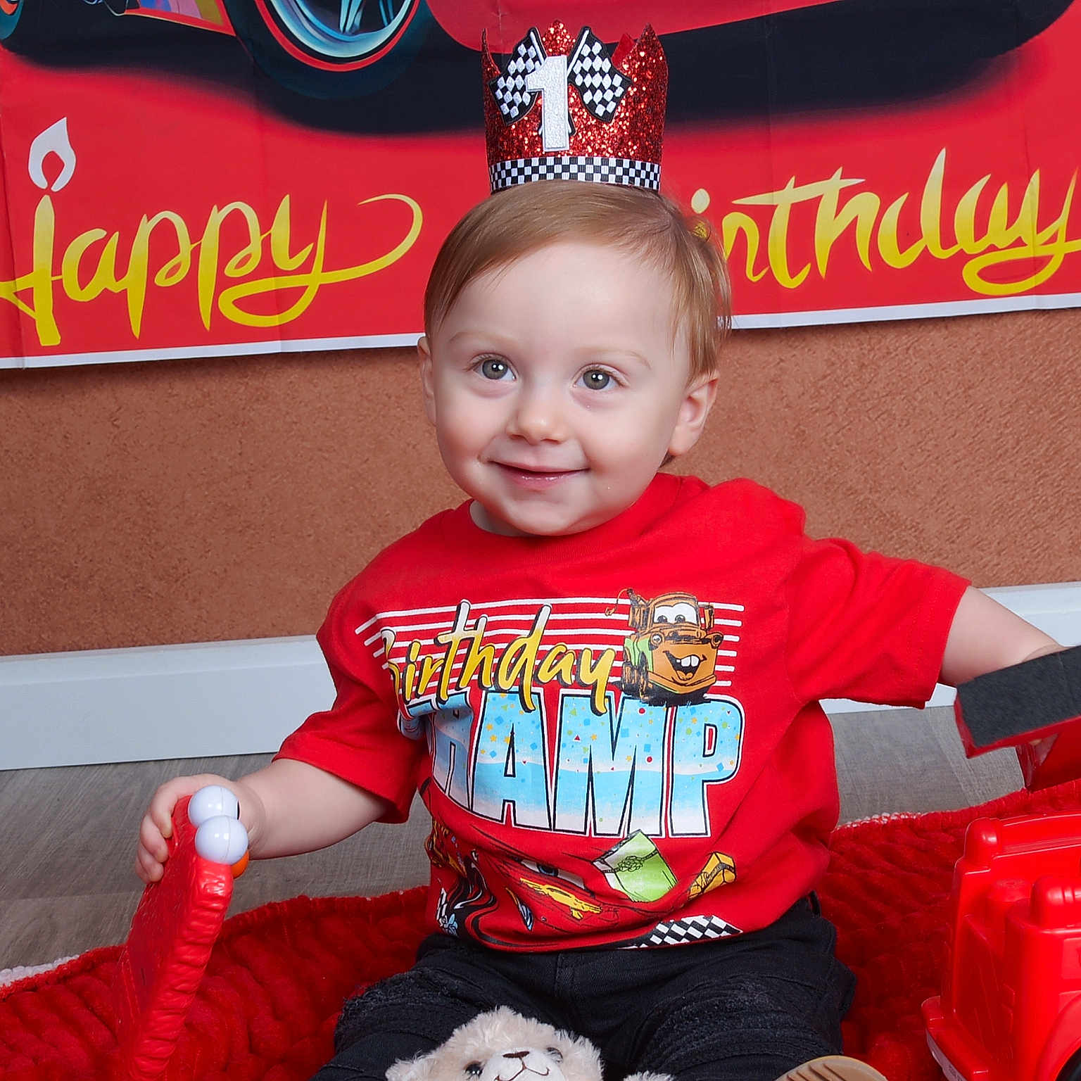 Lancer joined the competition — help win amazing prizes! birthday, blanket, celebration, child, crown, cute, event, face, floor, happy, indoor, party, red, red_shirt, sitting, smile, smiling, toddler, toy, young_child