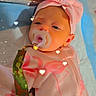 Serenity is registered to the contest to win money with this photo: baby, infant, pacifier, headband, pink_clothing, flamingo_print, lying_down, blanket, heart_lights, cute, newborn, sleepwear, soft_lighting, indoors, closeup, adorable, child, baby_girl, comfort, peaceful