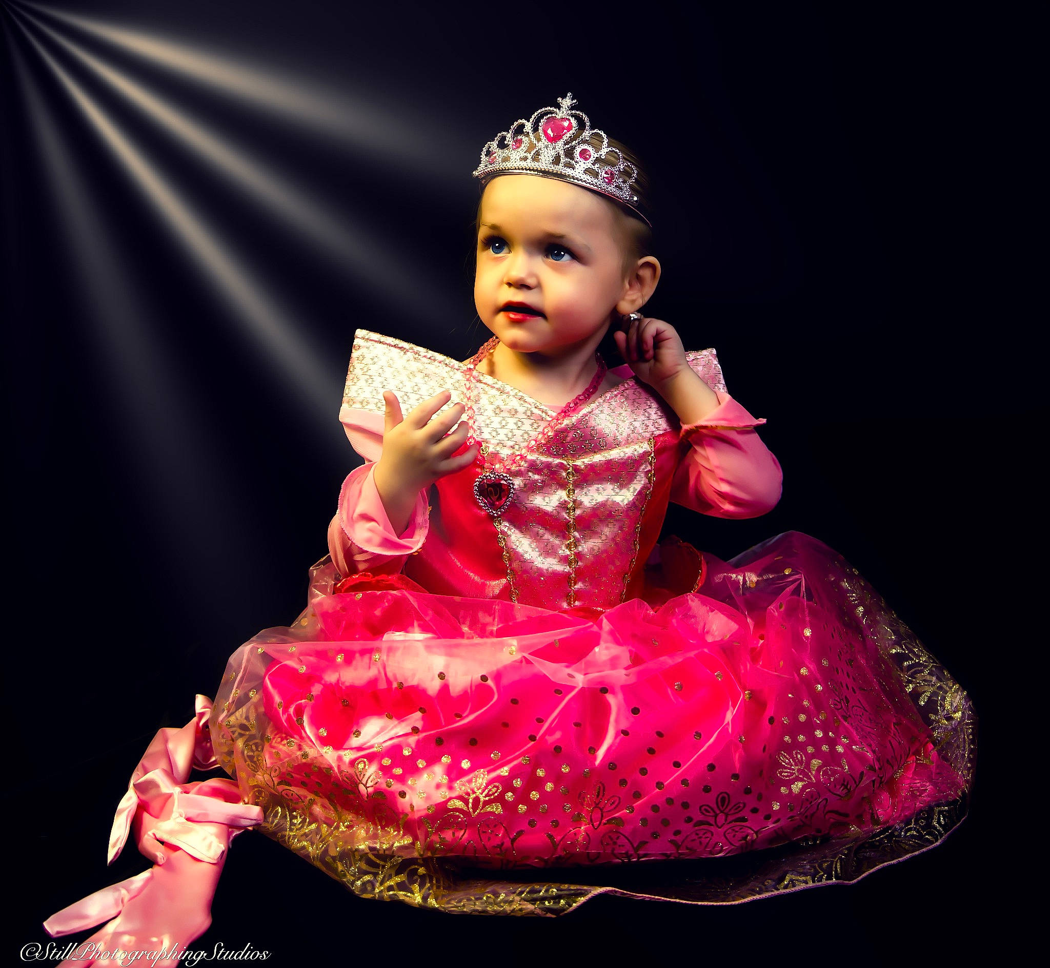 Jolene is registered to the contest to win money with this photo: baby_toddler_clothing, day_dress, dress, embellishment, entertainment, event, face, fashion_design, flash_photography, formal_wear, happy, head, headpiece, headwear, human_body, magenta, performing_arts, person, pink, purple