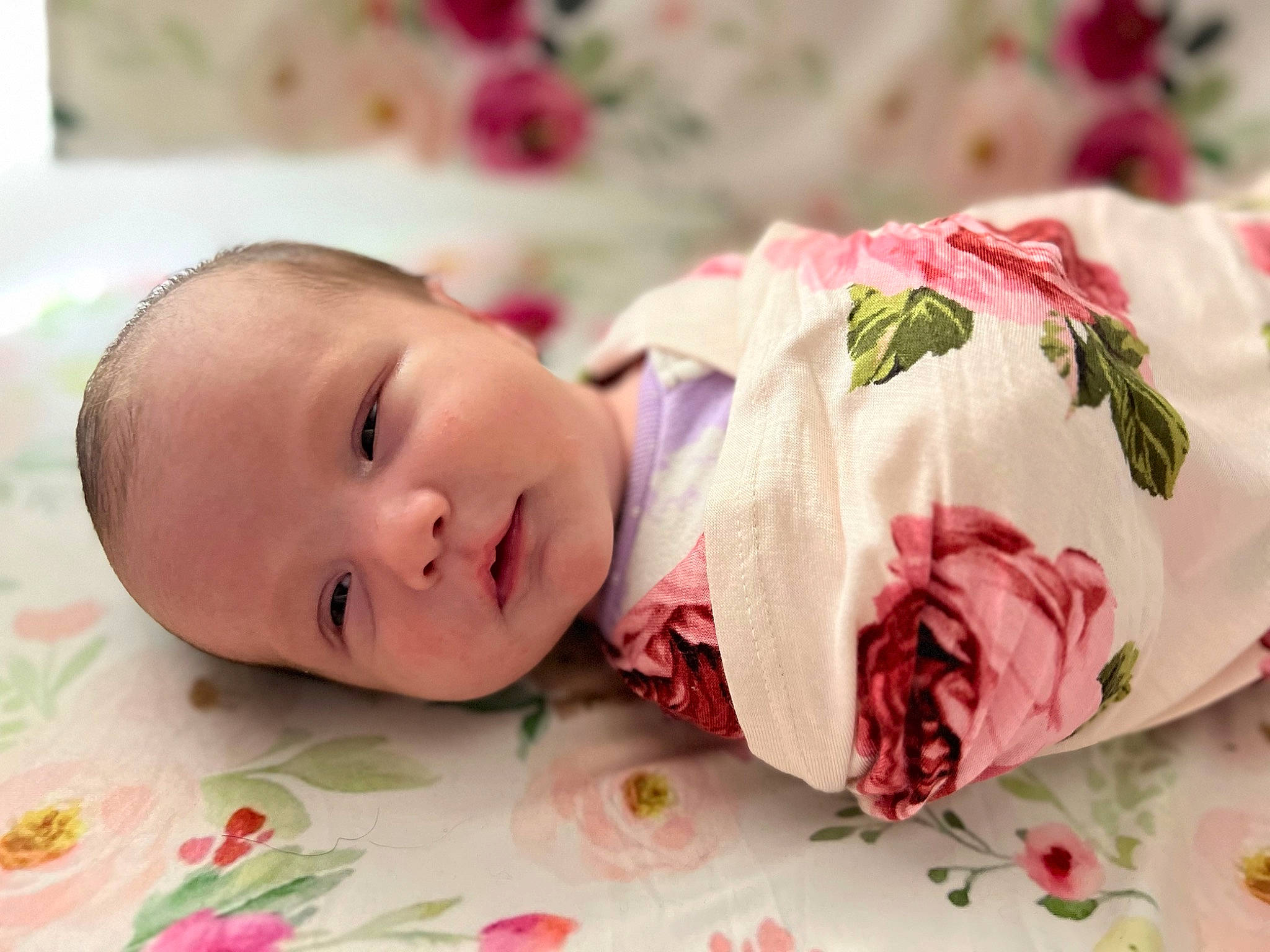 Marilyn is registered to the contest to win money with this photo: baby, baby_toddler_clothing, carmine, child, collar, comfort, creative_arts, happy, linens, pattern, person, petal, pink, plant, portrait_photography, rose, rose_family, rose_order, skin, sleeve