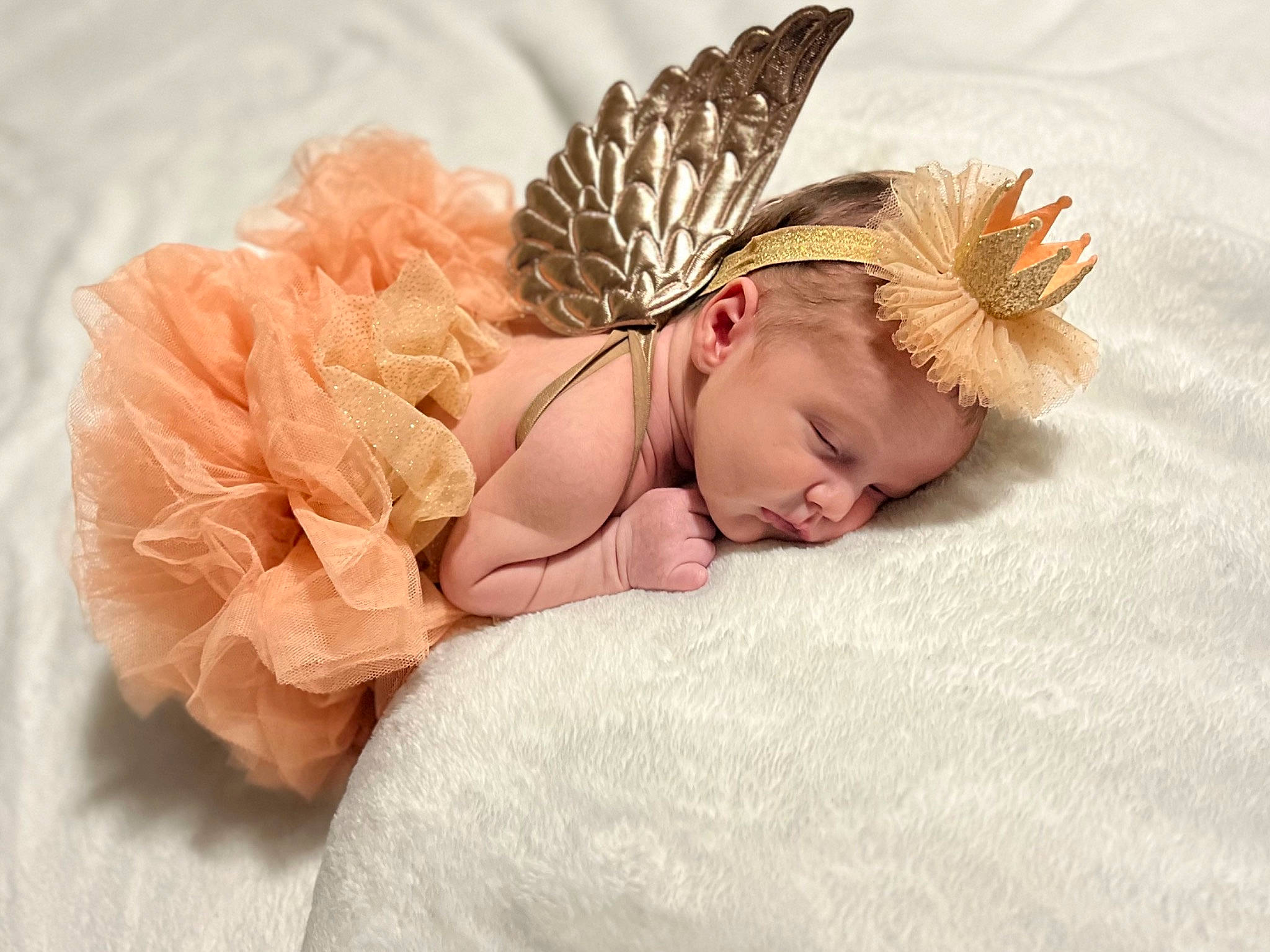 Marilyn is registered to the contest to win money with this photo: baby, baby_sleeping, baby_toddler_clothing, cap, comfort, costume_hat, fashion_accessory, fur, hair_accessory, hat, head, headband, headgear, headpiece, linens, peach, person, petal, plant, sun_hat