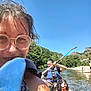 Oréo a rejoint le concours — aidez-le/la à gagner de superbes lots ! adventure, blue_sky, dog, glasses, kayak, life_vest, man, mountains, nature, outdoor, paddle, pets, recreation, river, smile, summer, sunlight, trees, water, woman