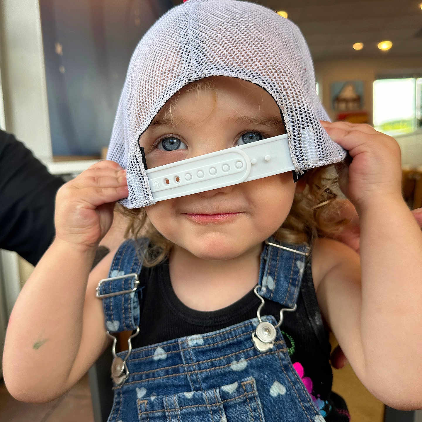 Primrose joined the competition — help win amazing prizes! adult, baby, baseballcap, bodypart, cap, clothing, costume, face, finger, hand, happy, hat, head, jeans, male, man, pants, person, photography, portrait