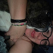 Iron a rejoint le concours — aidez-le/la à gagner de superbes lots ! person, dog, glasses, bracelets, snuggling, closeup, indoor, affection, dark, brindle, face, arm, human, pet, cozy, intimate, resting, casual, candid, warm