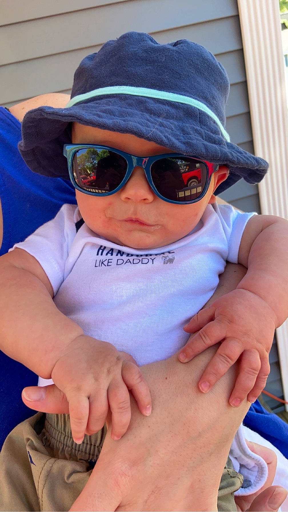 Jay is registered to the contest to win money with this photo: baby, baby_toddler_clothing, cap, child, cool, eyewear, finger, gesture, glasses, goggles, hand, hat, headgear, headwear, person, photograph, sleeve, sun_hat, sunglasses, toddler