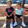 Amelliano joined the competition — help win amazing prizes! toddler, child, sitting, outdoor, concrete, sneakers, nike, blue, shorts, shirt, hair_bow, tree, sunlight, side_by_side, curious, smiling, people, shoe, casual, daytime