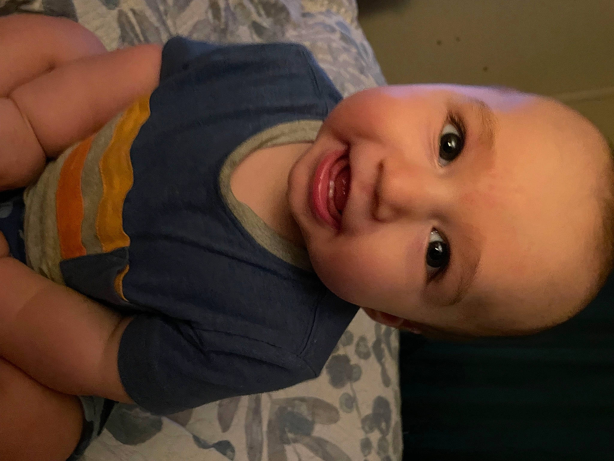 Jay is registered to the contest to win money with this photo: arm, baby, baby_toddler_clothing, cheek, comfort, eyelash, forehead, fun, gesture, hairstyle, happy, iris, lip, mouth, neck, nose, person, skin, smile, thumb