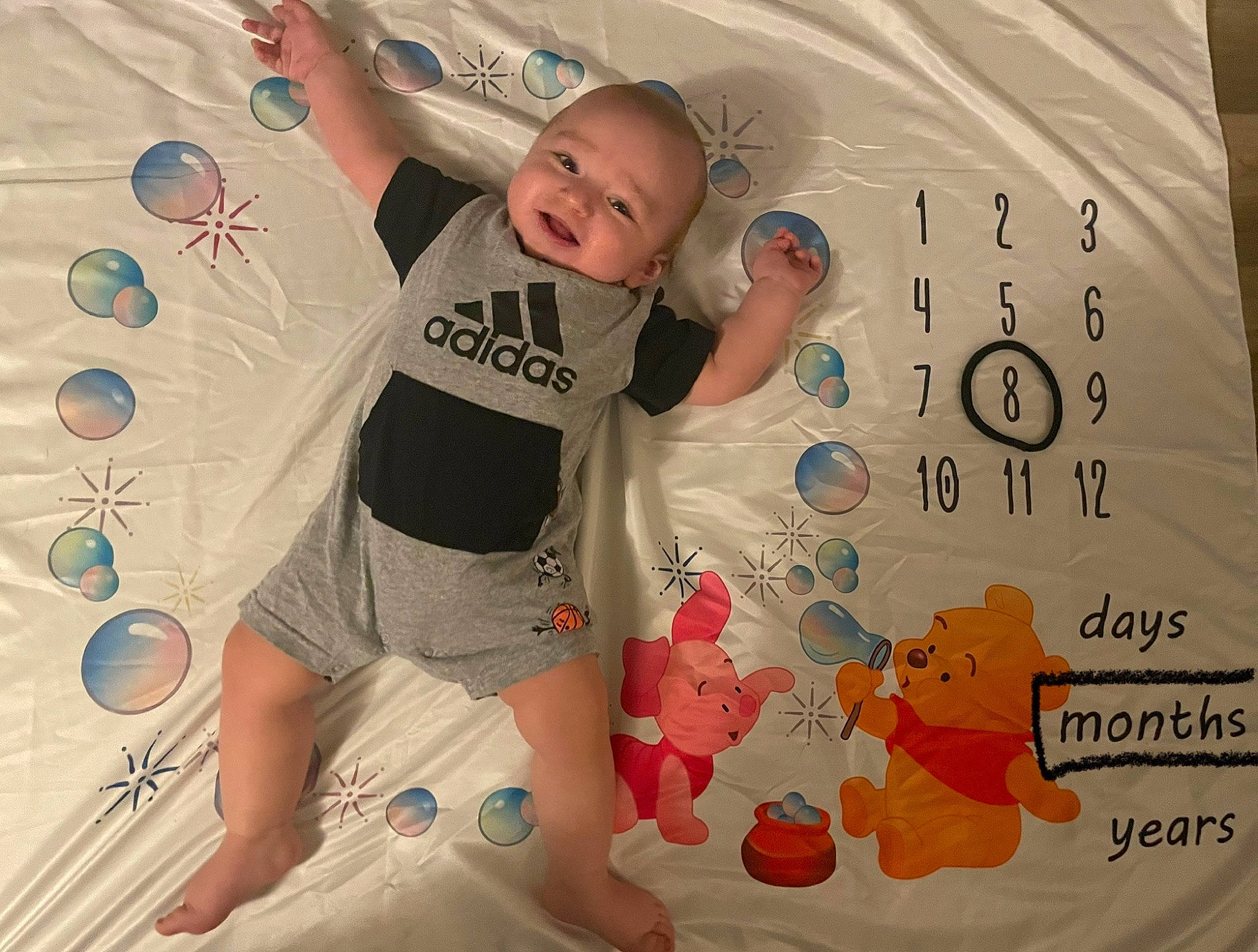 Jay is registered to the contest to win money with this photo: baby, baby_toddler_clothing, child, comfort, font, fun, happy, human_leg, linens, pattern, person, pink, product, room, shorts, sleeve, smile, t_shirt, textile, thigh