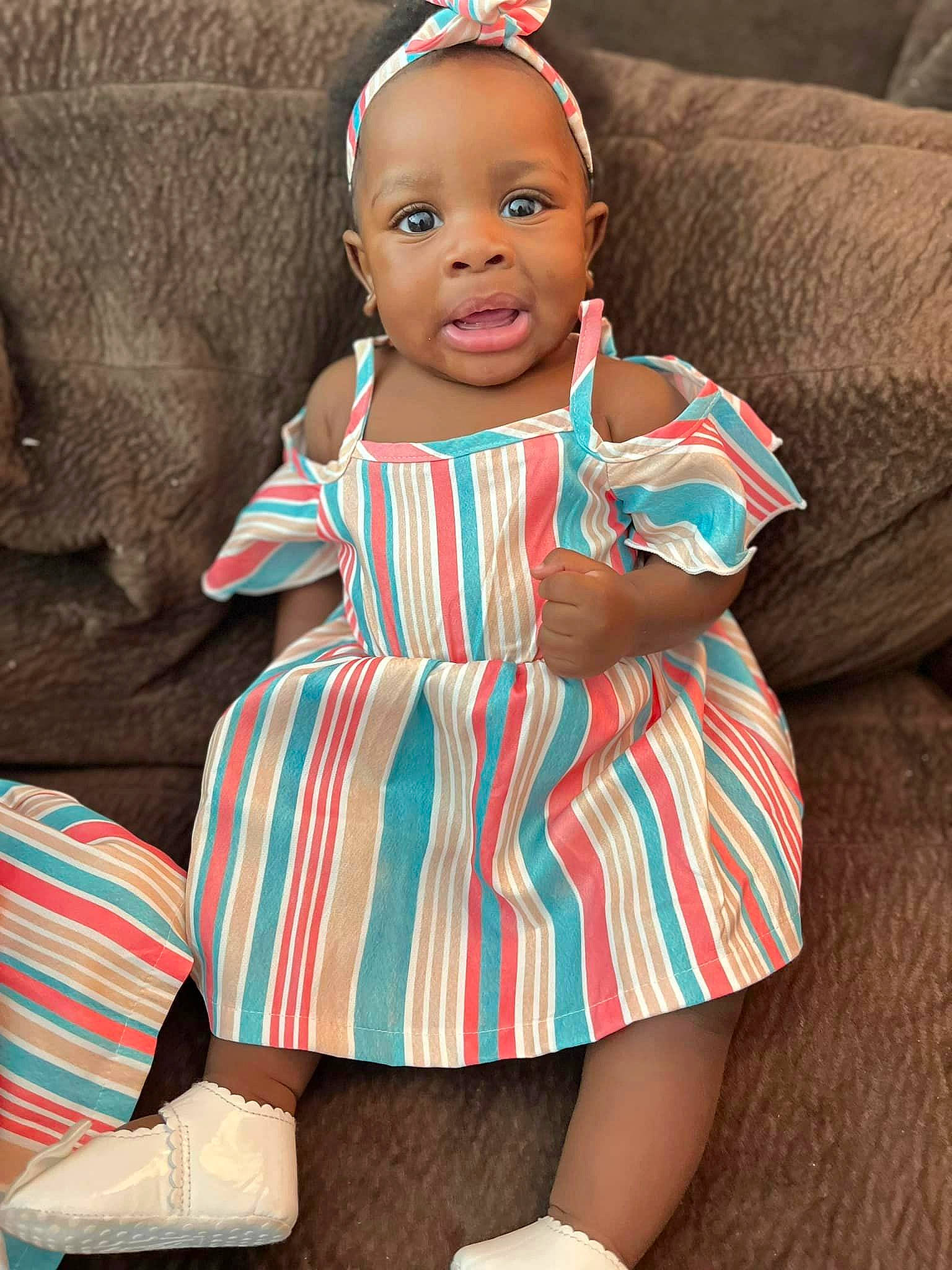 Maylahn joined the competition — help win amazing prizes! baby_toddler_clothing, couch, day_dress, dress, face, fashion_design, head, human_body, human_leg, knee, leg, pattern, person, pink, plaid, skin, sleeve, t_shirt, textile, thigh