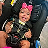 Sevyn joined the competition — help win amazing prizes! baby, car_seat, child, smiling, pink_bow, fuzzy_boots, safety_harness, happy, infant, clothing, footwear, indoor, person, cute, headwear, expression, seat, protection, skin, small_child