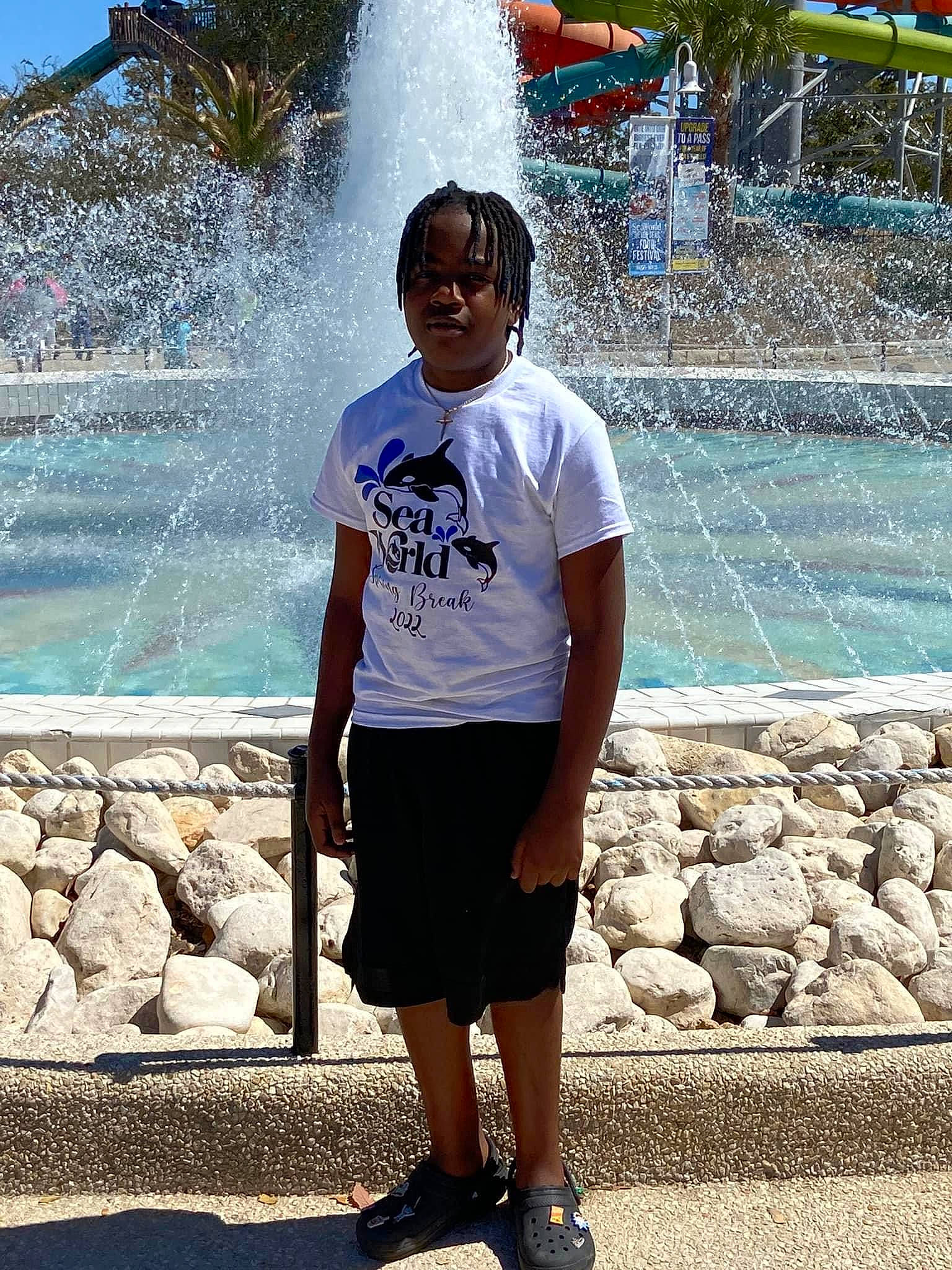 Willie is registered to the contest to win money with this photo: azure, black, blue, fountain, fun, green, happy, leisure, person, photograph, recreation, shorts, sleeve, snapshot, street_fashion, summer, travel, tree, waist, water