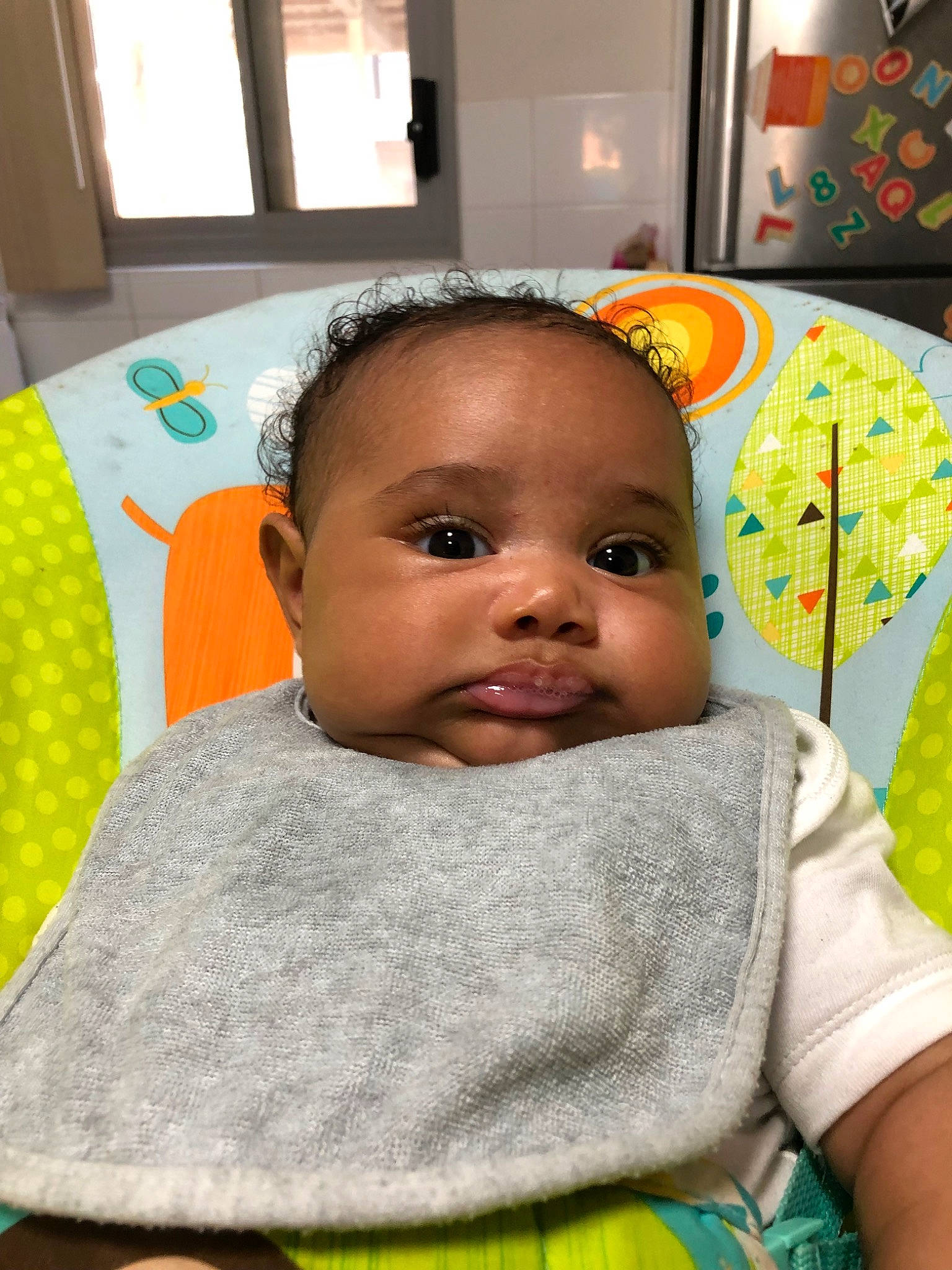 Evander is registered to the contest to win money with this photo: baby, beauty, cheek, child, eye, face, head, iris, linens, lip, nose, person, room, skin, smile, textile, toddler, yellow