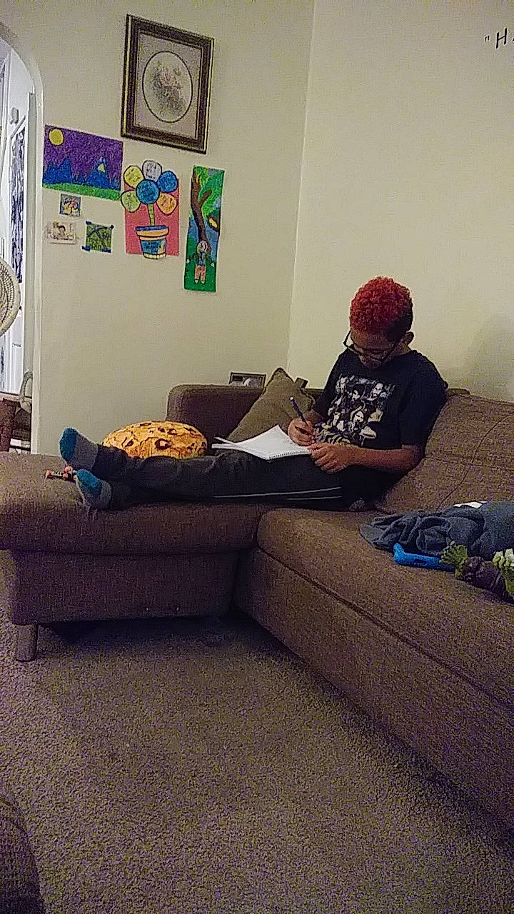 Brandon is registered to the contest to win money with this photo: comfort, couch, floor, furniture, house, interior_design, living_room, person, room, sitting, table