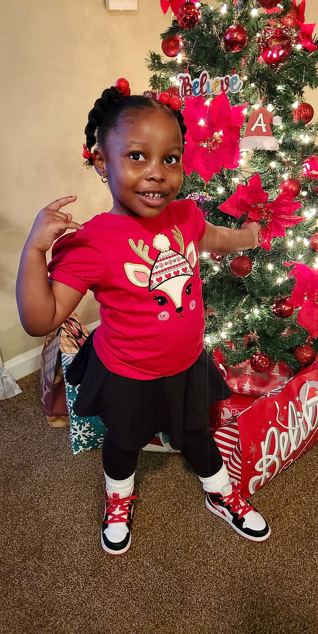 Aubri  joined the competition — help win amazing prizes! baby_toddler_clothing, black, carmine, child, christmas, christmas_decoration, christmas_ornament, christmas_tree, event, face, happy, holiday, holiday_ornament, joy, magenta, person, plant, red, sleeve, smile