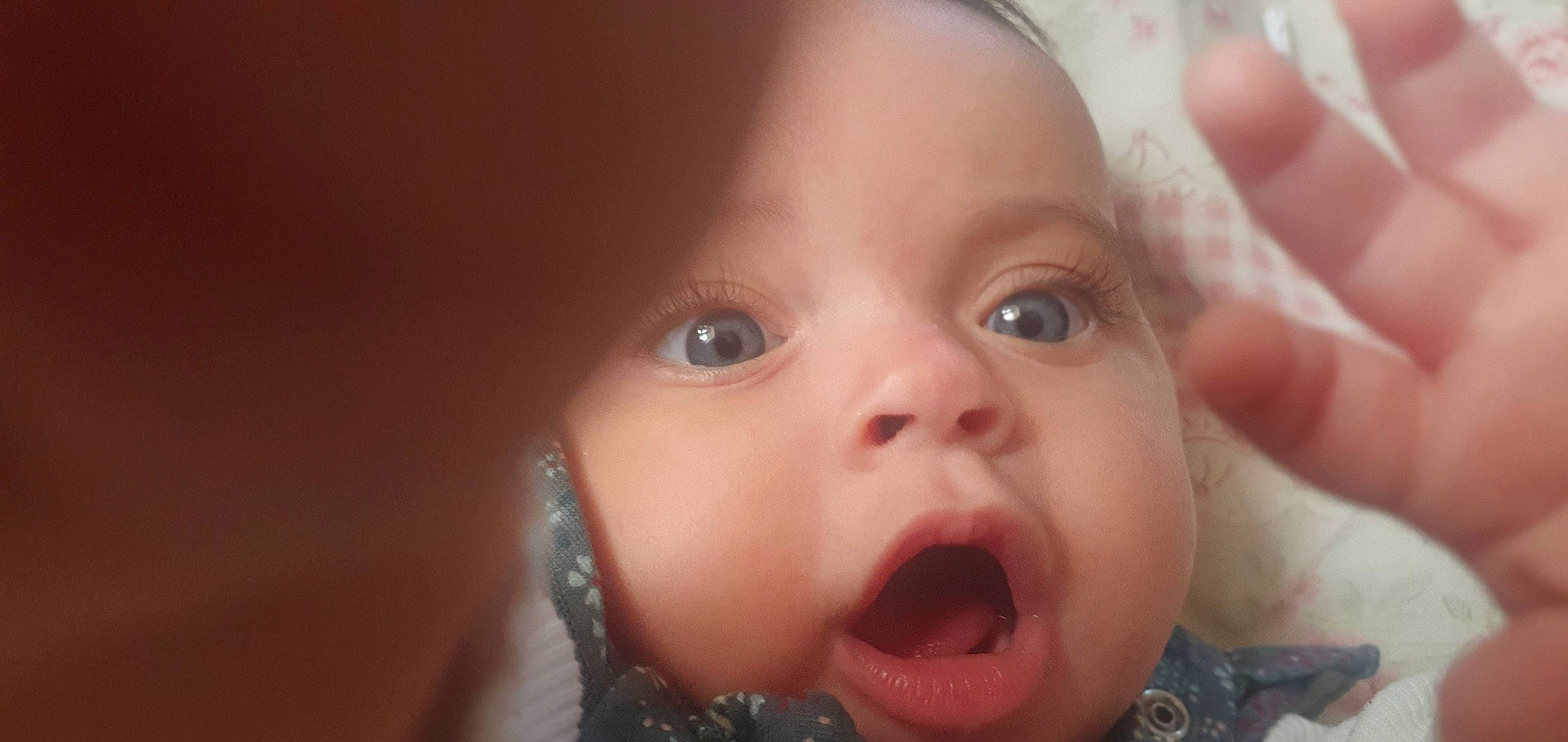 Aurelia is registered to the contest to win money with this photo: baby, cheek, chin, ear, eye, eyebrow, eyelash, face, forehead, gesture, happy, human_body, iris, jaw, lip, mouth, nose, person, skin, tongue