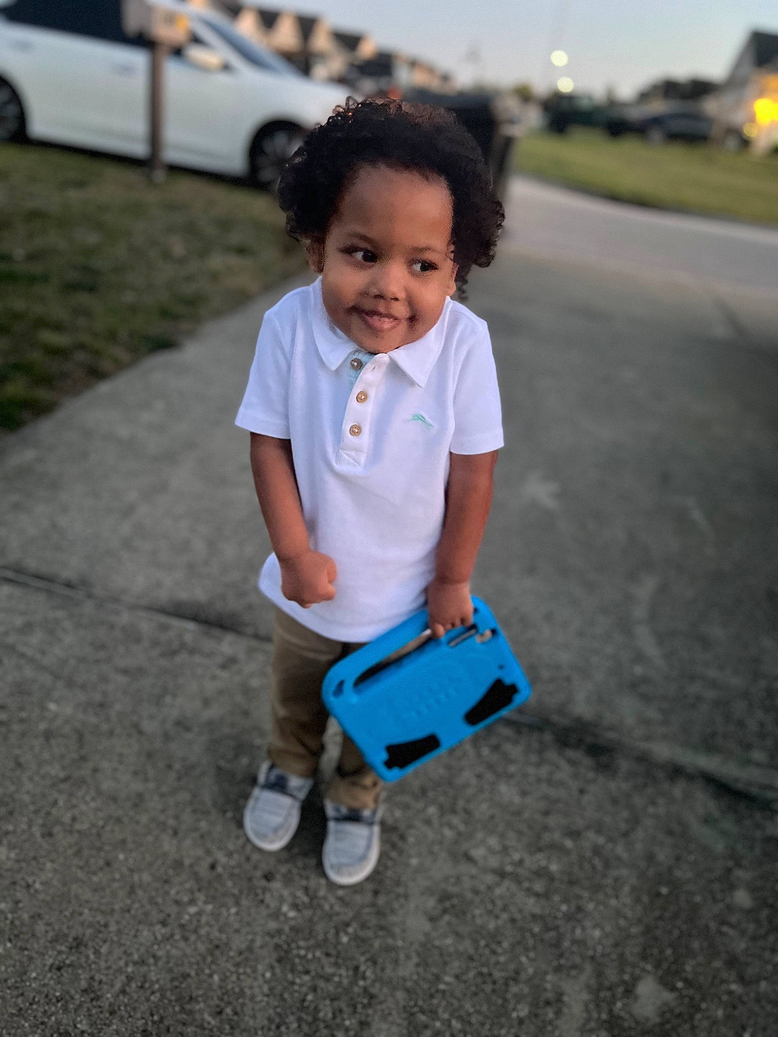 Roman is registered to the contest to win money with this photo: asphalt, baby_toddler_clothing, child, city, electric_blue, family_car, fun, grass, hand, happy, joy, leisure, person, public_space, recreation, road, sitting, sky, smile, tire