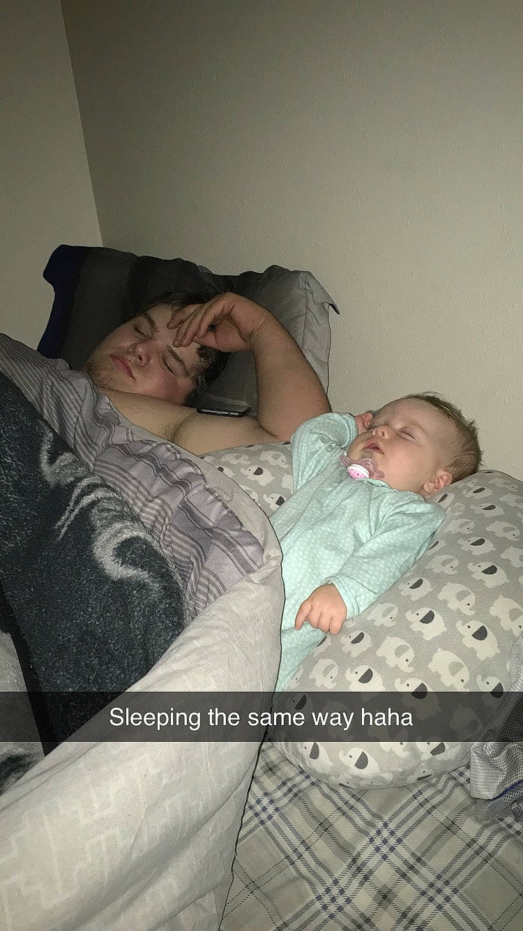 Aubriana is registered to the contest to win money with this photo: arm, baby, bed, bedtime, birth, child, comfort, daughter, father, furniture, gesture, headwear, hug, mother, nap, person, sleep, toddler