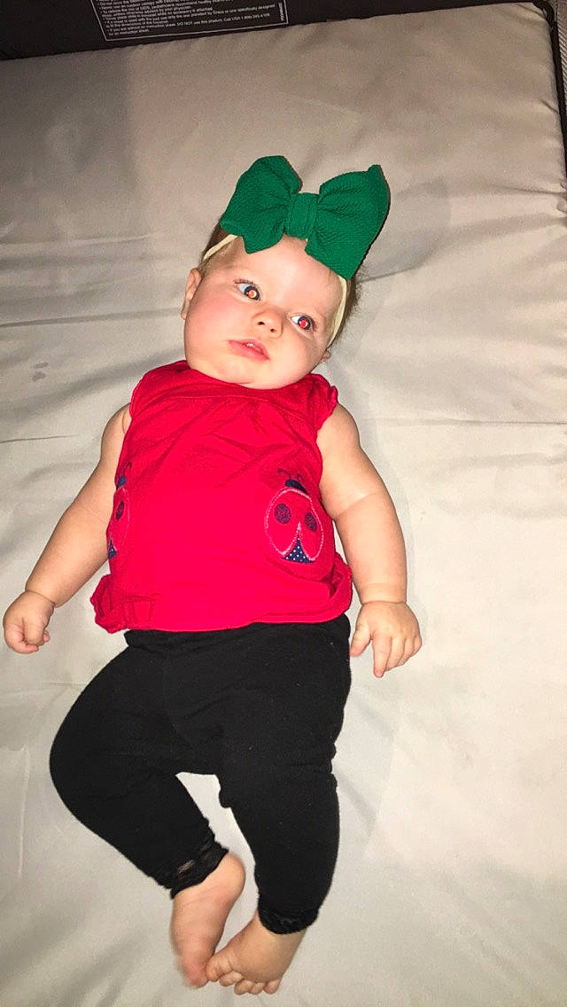 Aubriana is registered to the contest to win money with this photo: baby, baby_toddler_clothing, child, clothing, costume, fun, green, headgear, leg, person, pink, red, sleeve, smile, standing, t_shirt, toddler