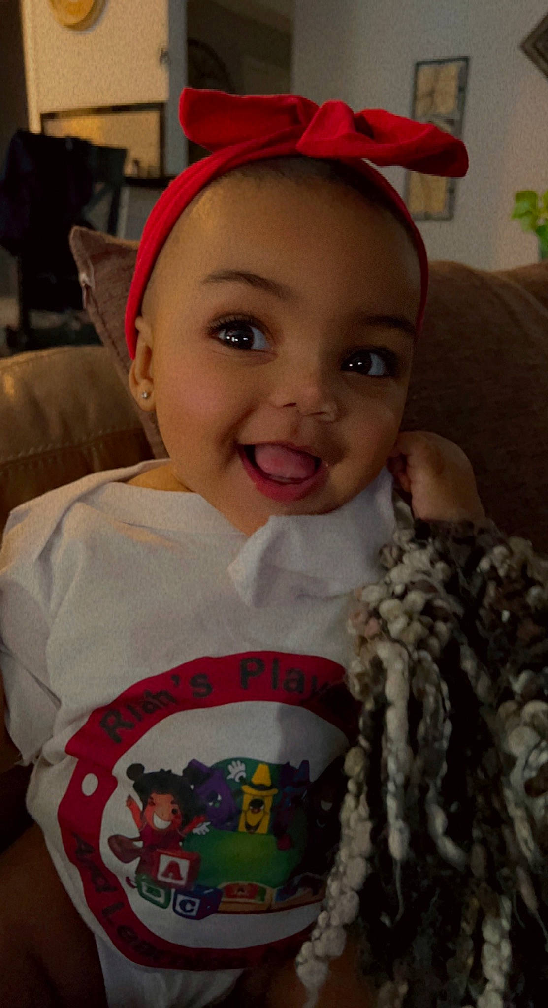 Mariah is registered to the contest to win money with this photo: cap, cheek, child, chin, eye, eyebrow, forehead, hair, happy, human_body, joy, lip, mammal, mouth, nose, organ, person, pink, skin, smile