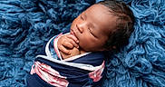Solanie is registered to the contest to win money with this photo: baby, blanket, blue, child, closeup, cozy, cute, face, floral, hands, infant, newborn, peaceful, portrait, resting, sleeping, soft, texture, warm, wrapped