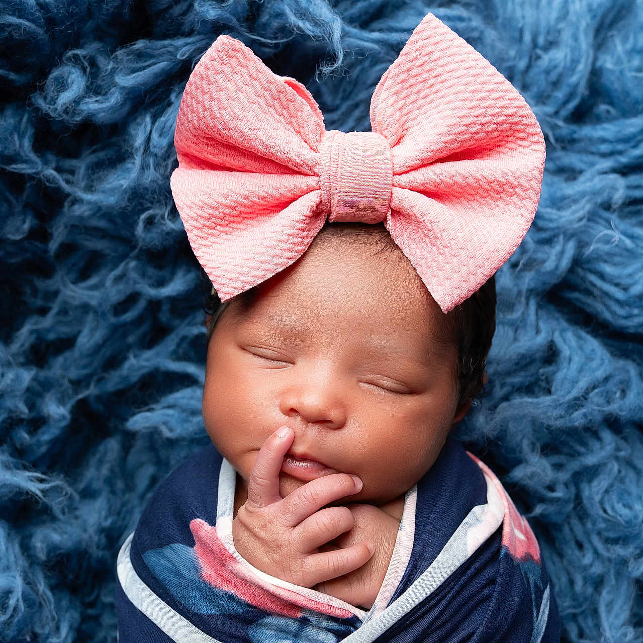 Solanie is registered to the contest to win money with this photo: adorable, baby, blanket, blue_background, child, closeup, cozy, cute, face, hands, headwear, infant, newborn, peaceful, pink_bow, portrait, resting, sleeping, soft_texture, wrapped
