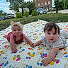 baby, child, outdoor, blanket, colorful, holding_hands, grass, sky, building, tree, car, cute, infant, summer, playtime, headband, pattern, portrait, nature, happy