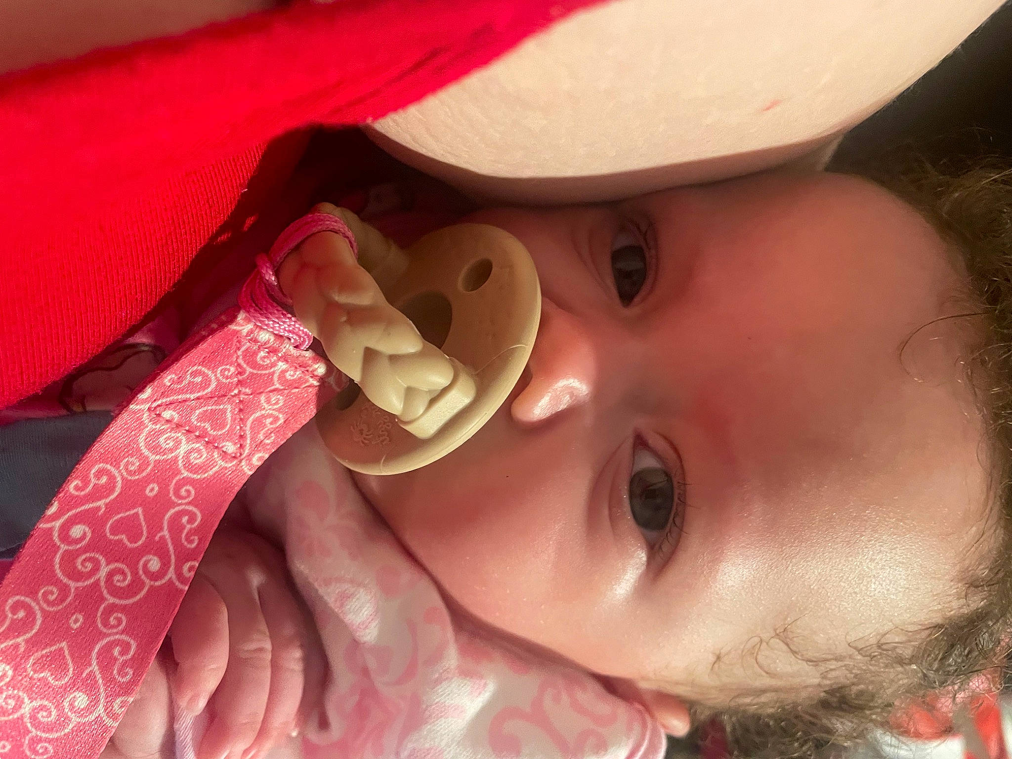 Londynn is registered to the contest to win money with this photo: baby, cap, cheek, costume_hat, eyebrow, eyelash, fedora, gesture, happy, hat, headgear, helmet, lip, mouth, nose, person, pink, skin, smile, sun_hat