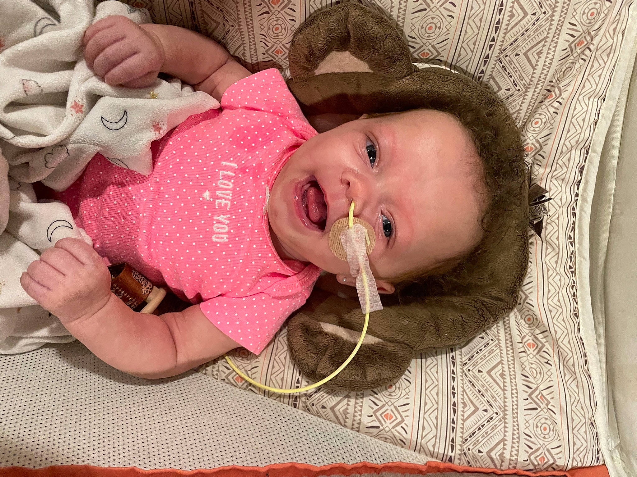 Londynn joined the competition — help win amazing prizes! baby, baby_products, baby_toddler_clothing, cheek, child, comfort, eye, eyelash, iris, linens, lip, mouth, nail, nose, pattern, person, portrait_photography, room, skin, textile