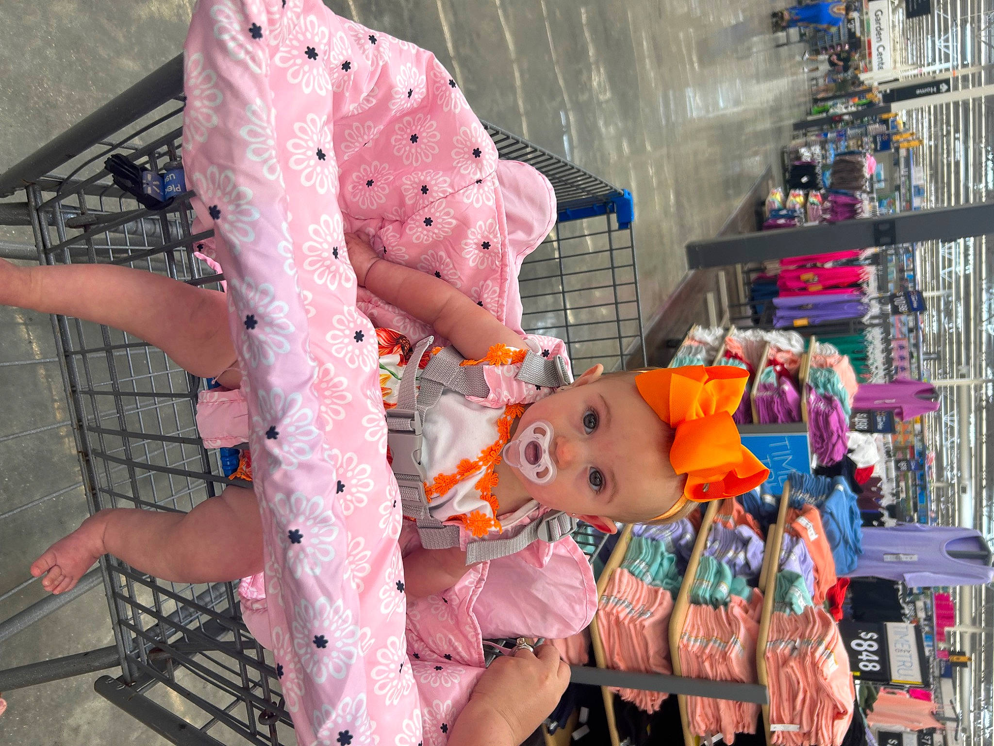 Evalynn is registered to the contest to win money with this photo: baby, baby_products, child, event, flesh, fun, leisure, magenta, pattern, person, pink, recreation, textile, toddler, toy, tree, vacation