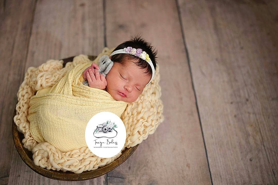 Alexa joined the competition — help win amazing prizes! baby, baby_sleeping, baby_toddler_clothing, beanie, cap, child, comfort, crochet, fashion_accessory, flash_photography, flooring, happy, headpiece, knit_cap, linens, person, sitting, toddler, wood, wool