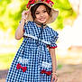 Anabia is registered to the contest to win money with this photo: blue_checkered, bracelet, casual, child, cute, dress, fashion, flower_crown, girl, happy, hat, lace, nature, outdoor, person, portrait, red_bows, smiling, sunhat, young