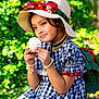 Anabia is registered to the contest to win money with this photo: accessories, bracelet, child, cupcake, cute, dress, fashion, floral, garden, gingham, girl, greenery, hat, outdoor, pearls, portrait, sitting, smile, summer, young