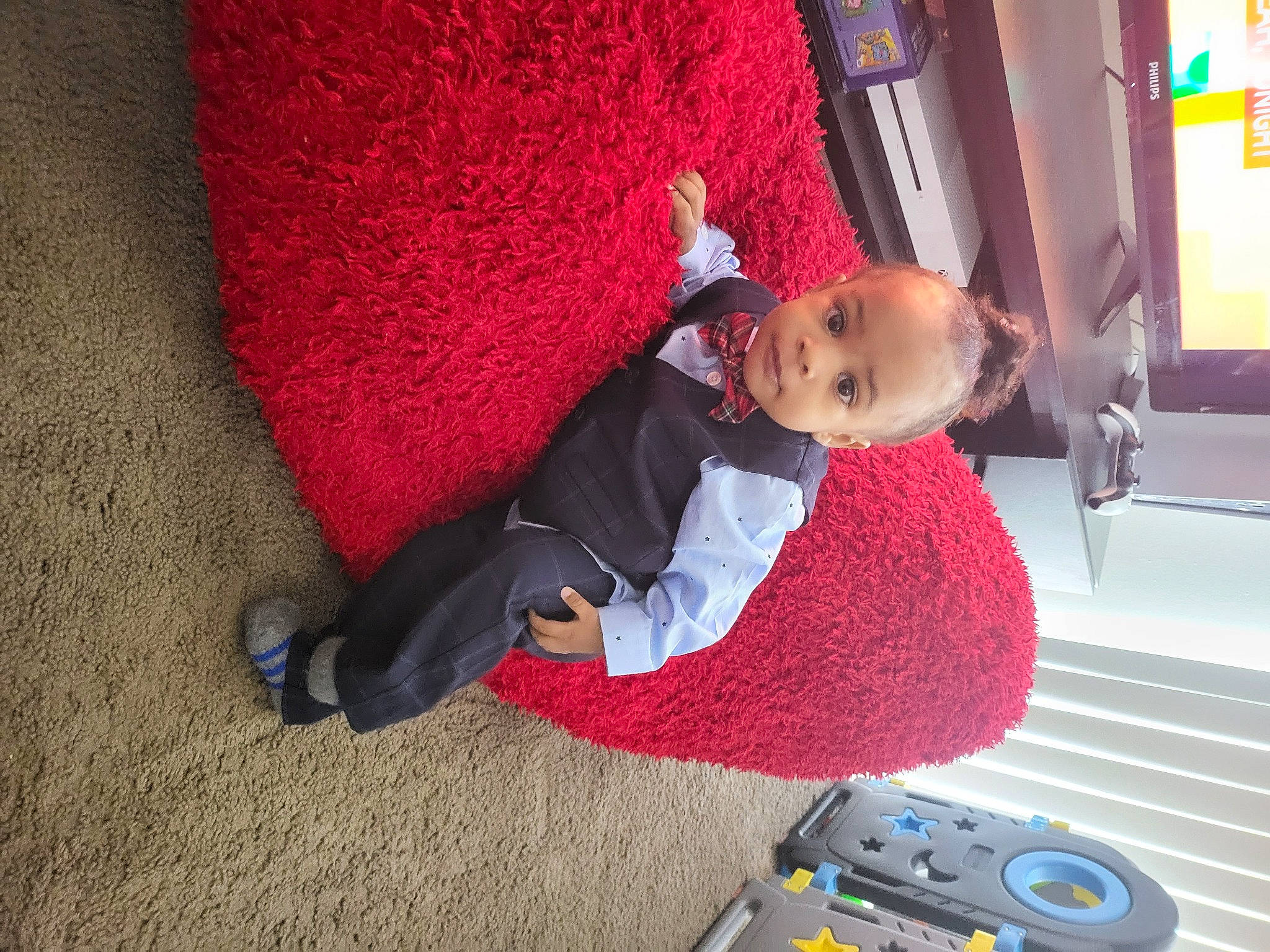 Jerome is registered to the contest to win money with this photo: baby, child, comfort, flooring, fun, leisure, magenta, person, play, room, sitting, toddler, tree